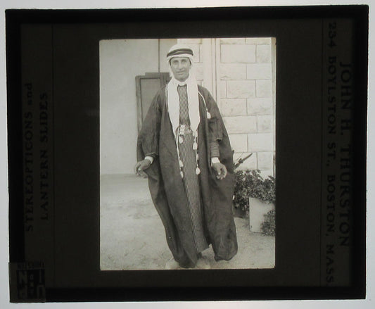 ARAB MAN IN TRADITIONAL CLOTHING. LANTERN SLIDE, 1926.