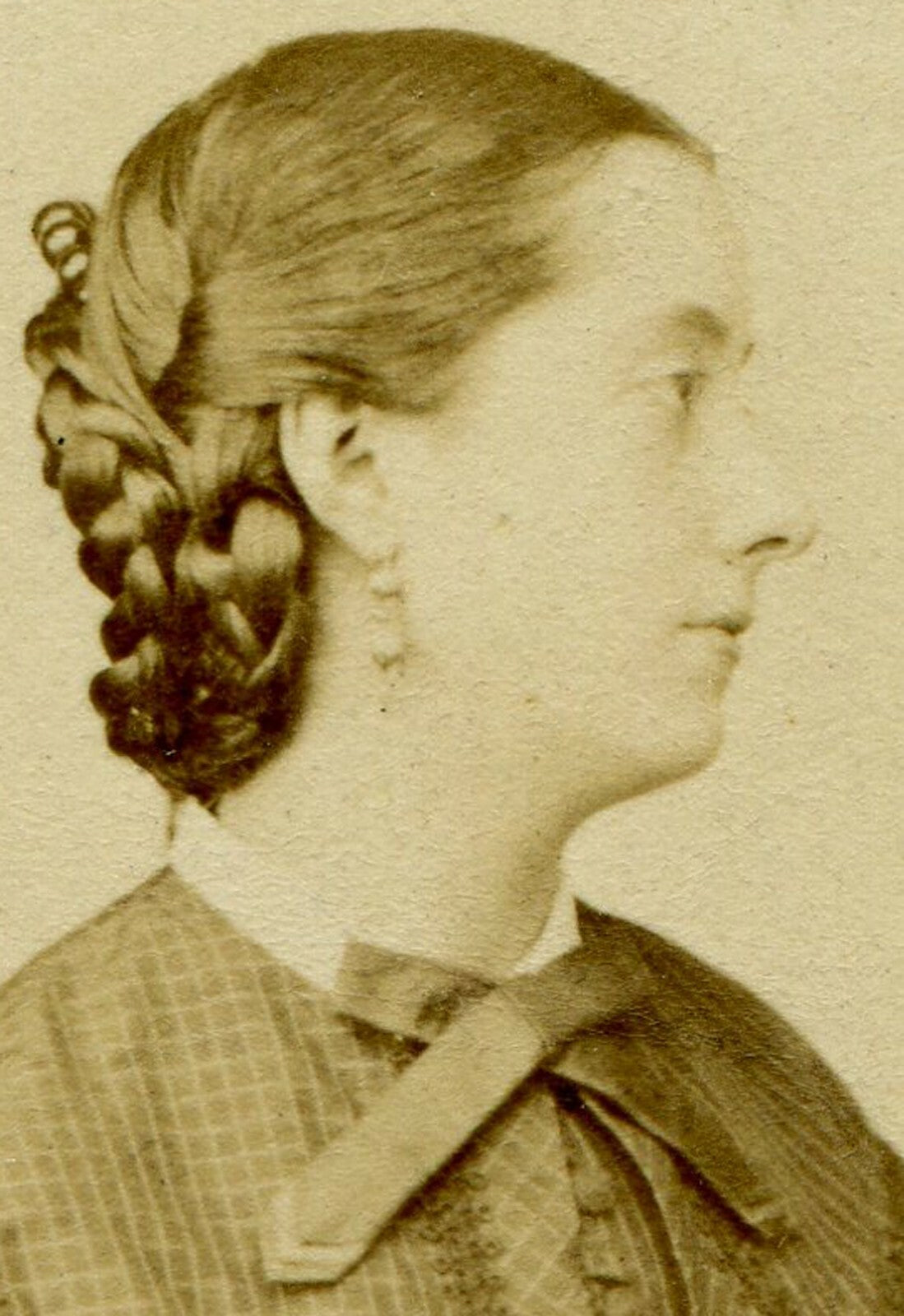 WOMAN, PROFILE POSE, BRAIDED HAIR. CDV, PARIS. MAKER MARK ON CARD BACK.