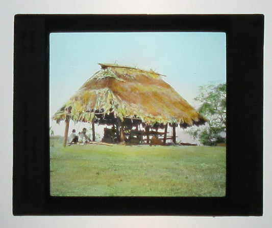 TRADITIONAL HUT, PANAMA. TINTED PHOTO ON GLASS. HAND COLORED PHOTO ON GLASS.