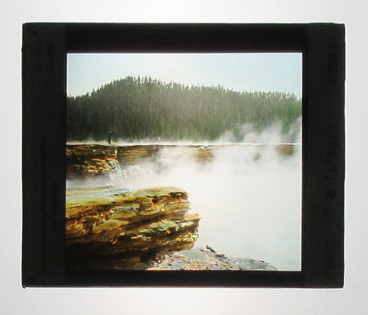 YELLOWSTONE PARK GEYSER. HAND COLORED PHOTO ON GLASS.