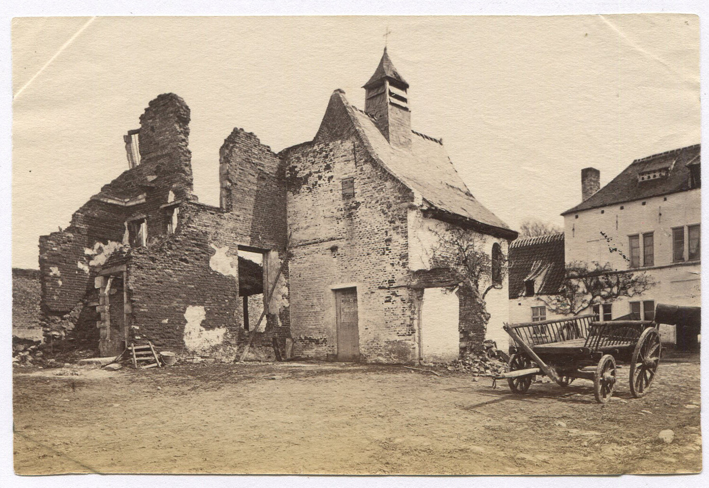 CRUMBLING HOUSE, FARM CART OUT FRONT. UNMOUNTED ALBUMEN.
