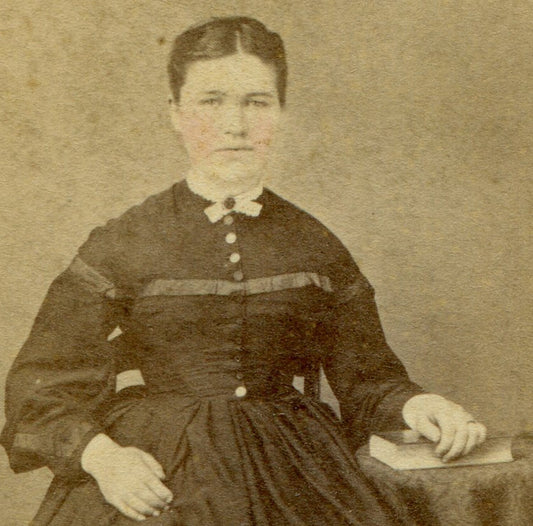 SARAH BROWER SEATED AT TABLE W/BOOK. TINTED CDV. PILLOW, PA.