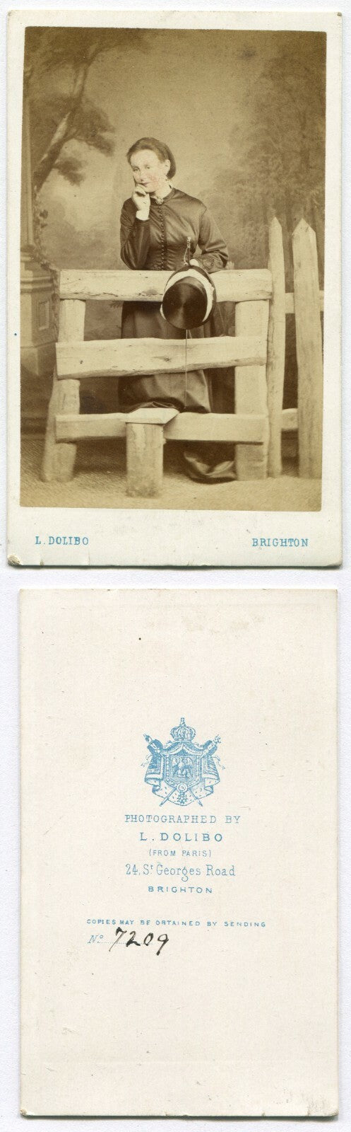 WOMAN IN RELAXED POSE HOLDING HAT, LEANING ON FENCE GATE. CDV. BRIGHTON, ENGLAND