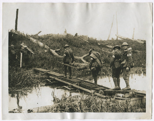 WOUNDED BEING CARRIED ACROSS YAER CANAL. WWI . (8X10 REPRINT)