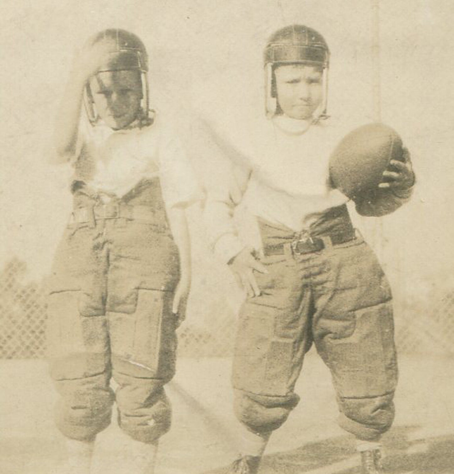BOYS IN EARLY FOOTBALL UNIFORMS. 4.5X2.75 TONED B&W.1920-30s.