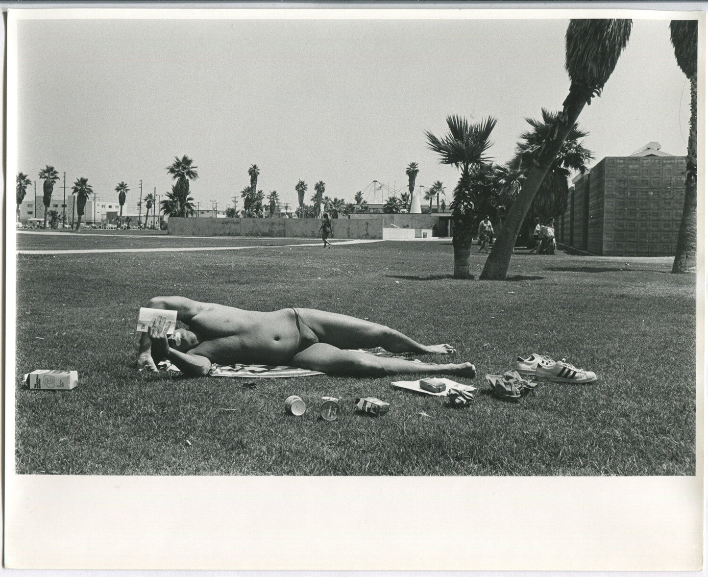 Vintage 1970s Black and White 8x10 Photo – Young Man Reading & Sunbathing with