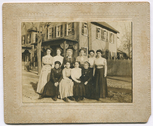 10 WOMEN POSE TOGETHER OUTSIDE HOME. 3.25X4.25 B&W ON 4.75X5.75 CARD.