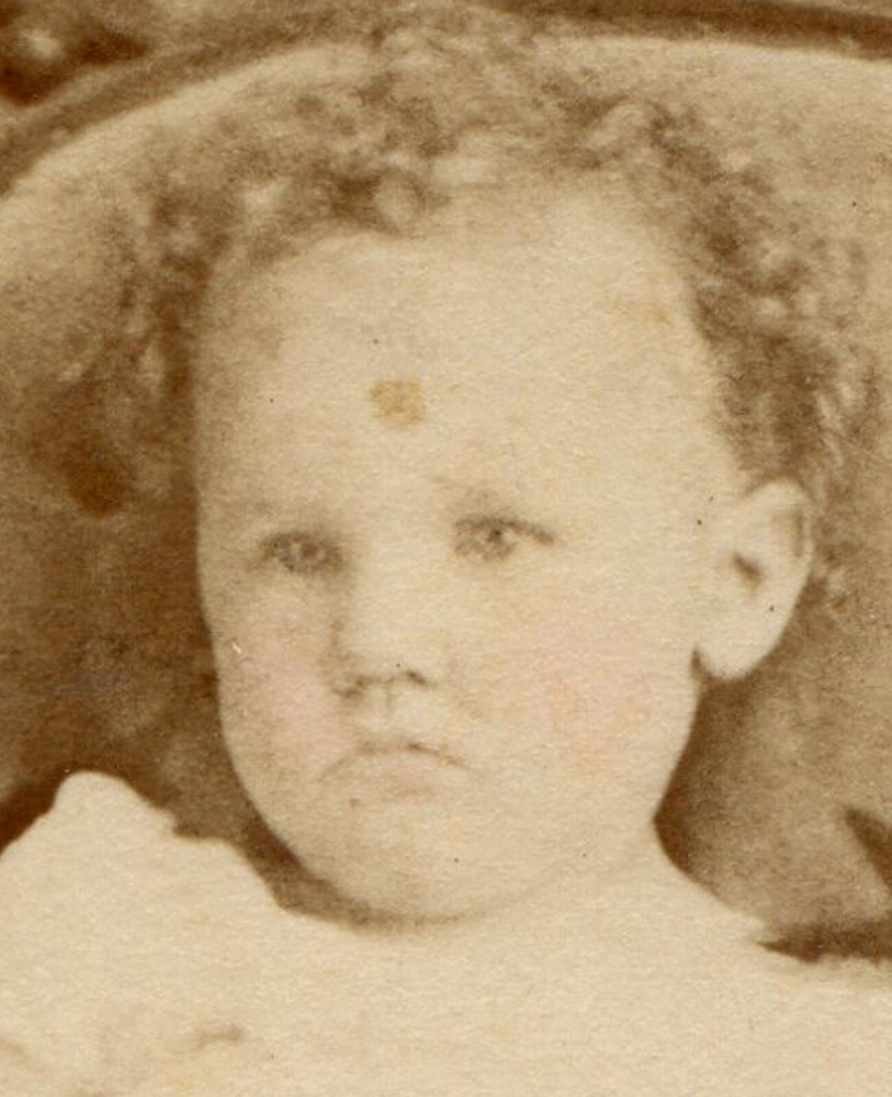 GRUMPY TODDLER SEATED ON ORNATE CHAIR. CDV. LEWISBURG, PA.