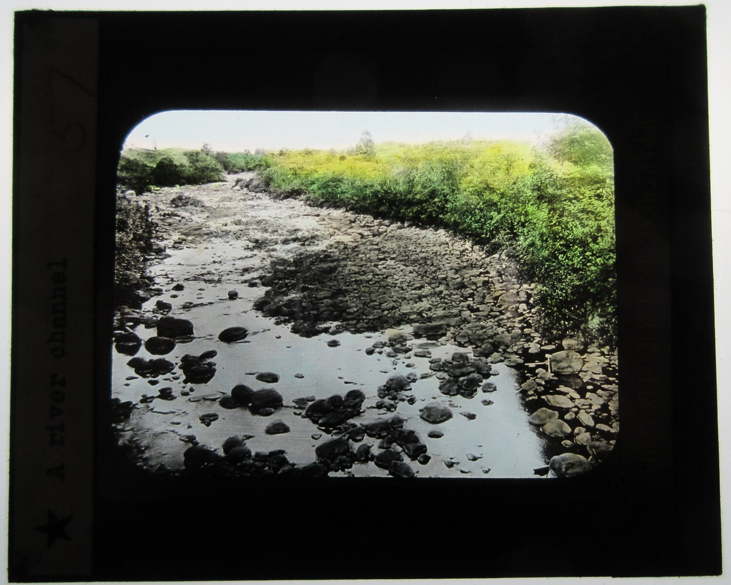 BEAUTIFUL RIVER CHANNEL. HAND COLORED PHOTO ON GLASS.