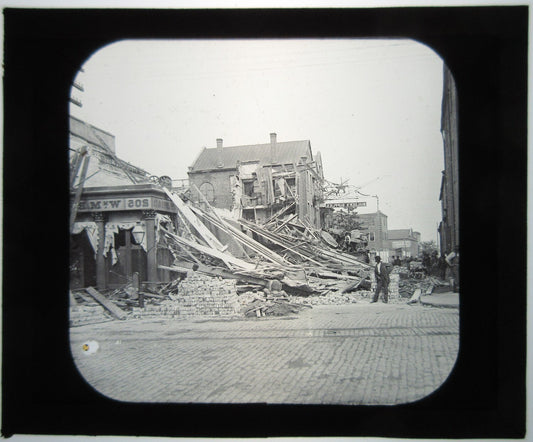 BUILDING COLLAPSE AFTERMATH. LANTERN SLIDE.