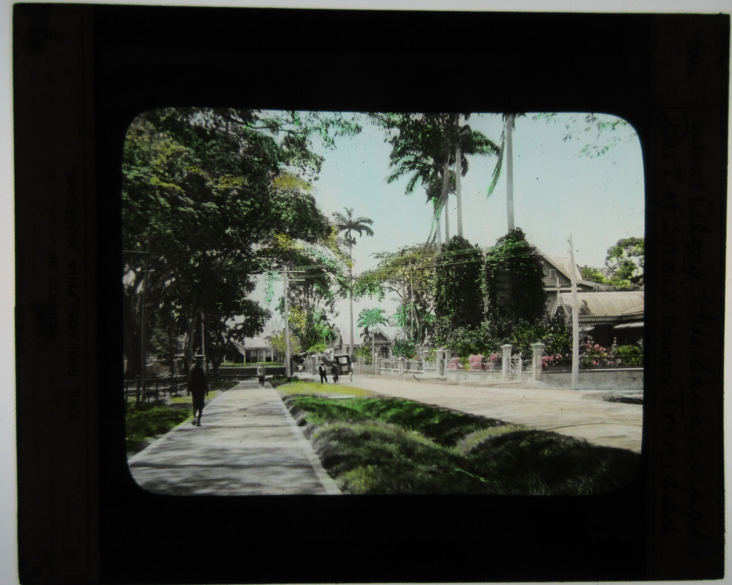 WALKWAY ALONG THE PORT OF SPAIN, TRINIDAD. HAND COLORED PHOTO ON GLASS.