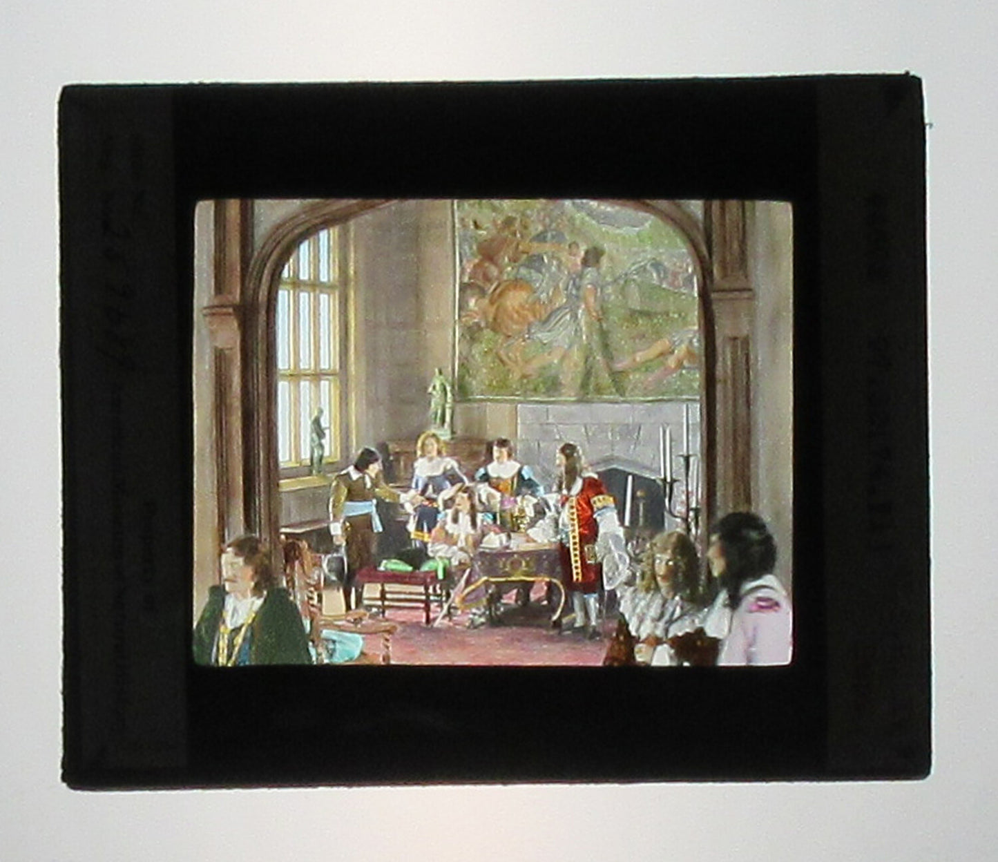 ACTORS PORTRAY BRITISH HISTORICAL EVENT. HAND COLORED PHOTO ON GLASS.