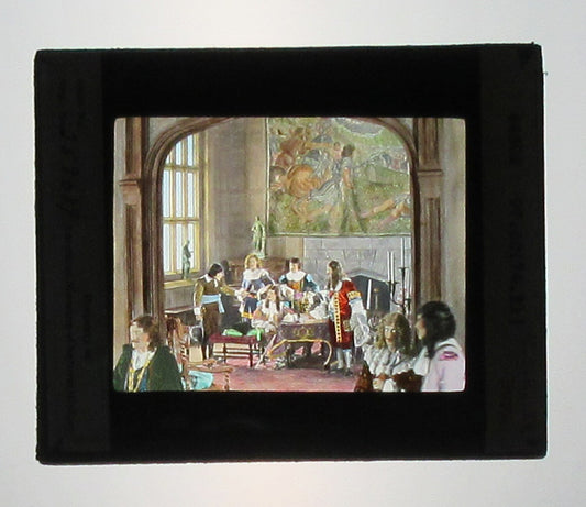 ACTORS PORTRAY BRITISH HISTORICAL EVENT. HAND COLORED PHOTO ON GLASS.