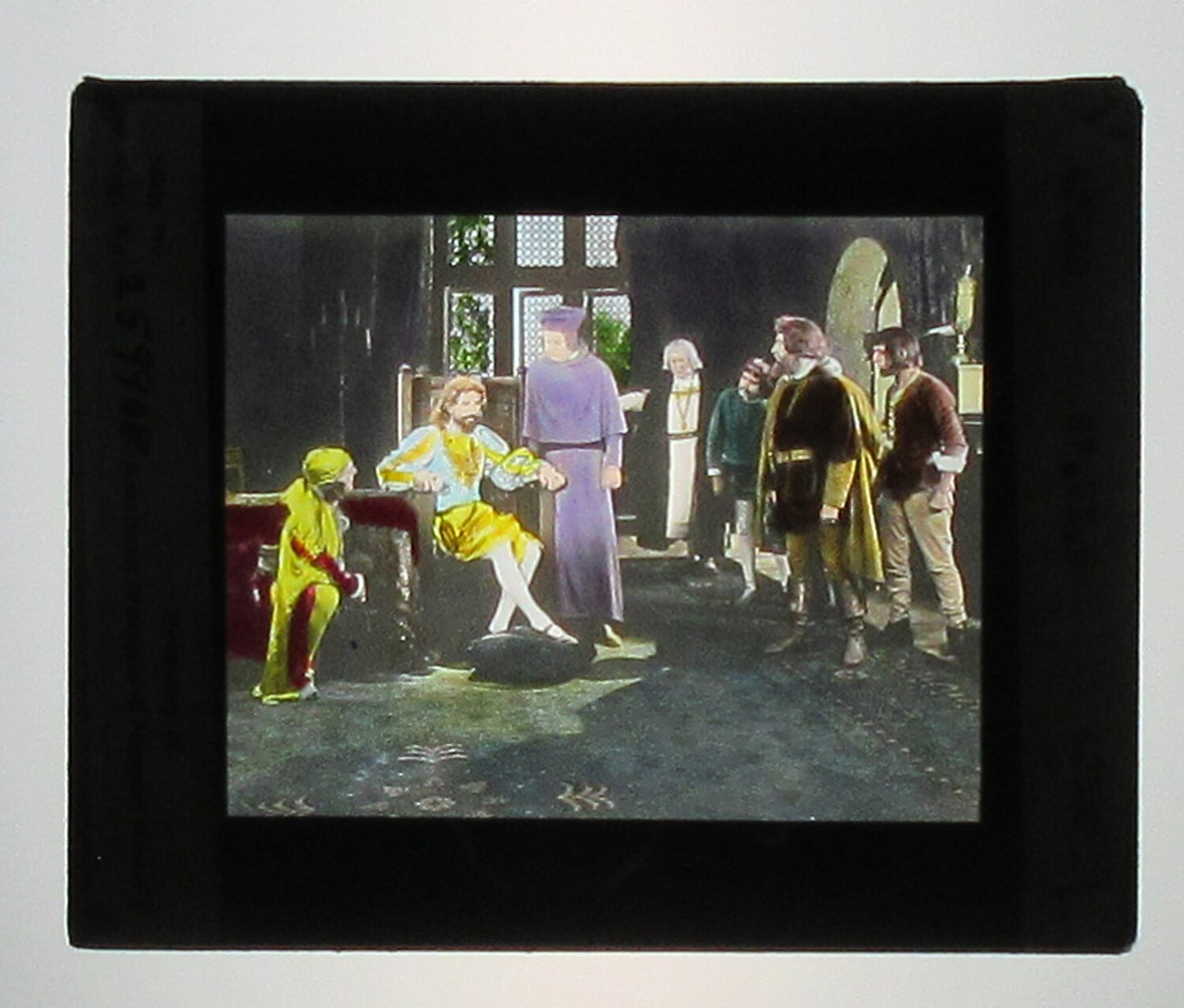 ACTORS PORTRAY KING JOHN GETTING BAD NEWS. TINTED PHOTO ON GLASS. HAND COLORED.