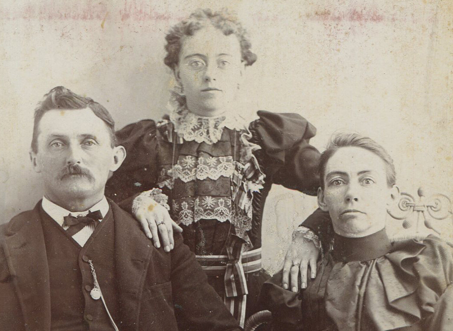 PARENTS POSED W/OVERBEARING DAUGHTER. GREAT DRESSES. CABINET CARD.