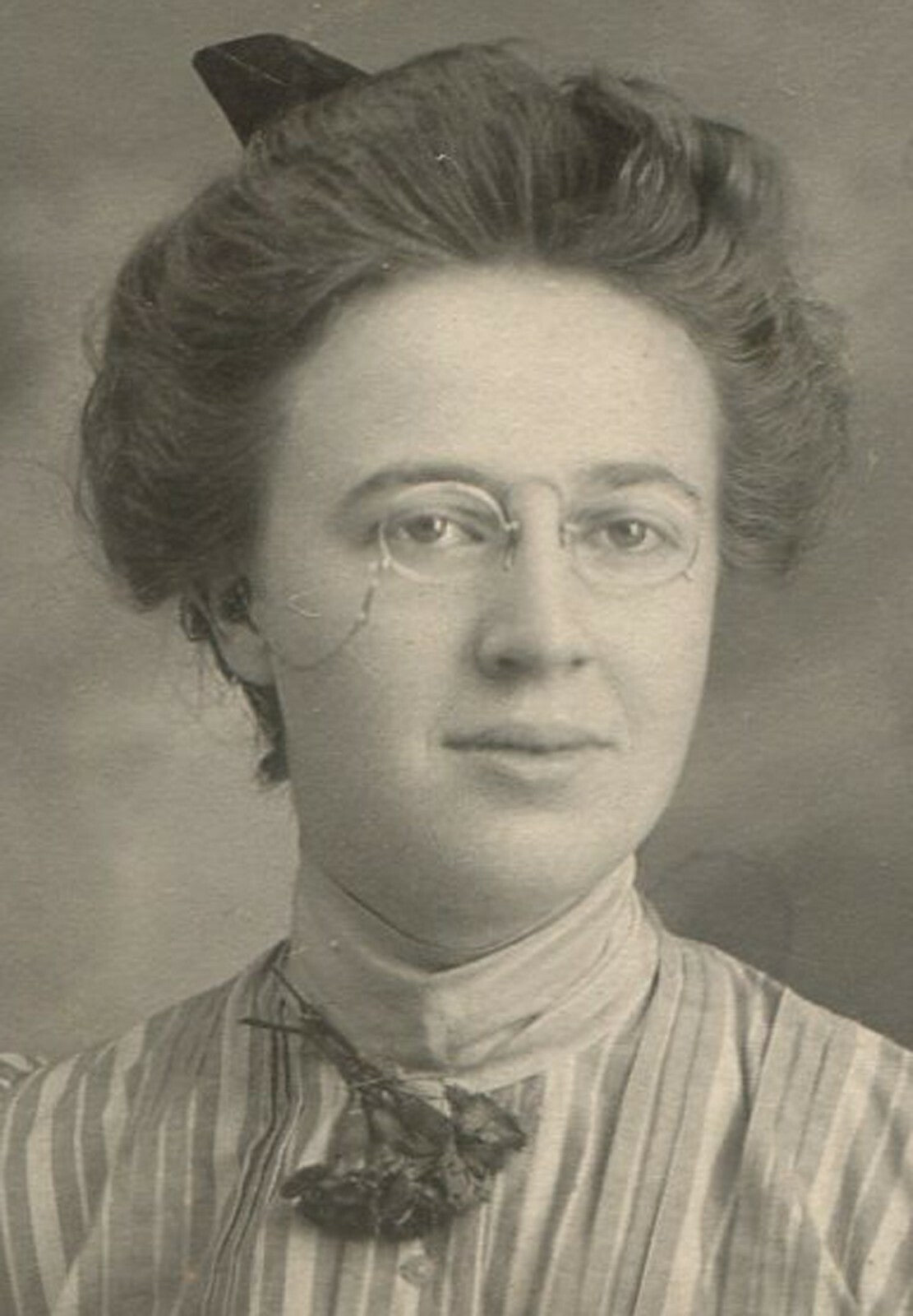 WOMAN,EYE GLASSES AND STRIPED DRESS. 1900s.4X3 INCHES.