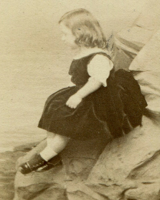 YOUNG GIRL POSED IN STUDIO SETTING/SITTING ON ROCKY BEACH. VERY UNIQUE. CDV.