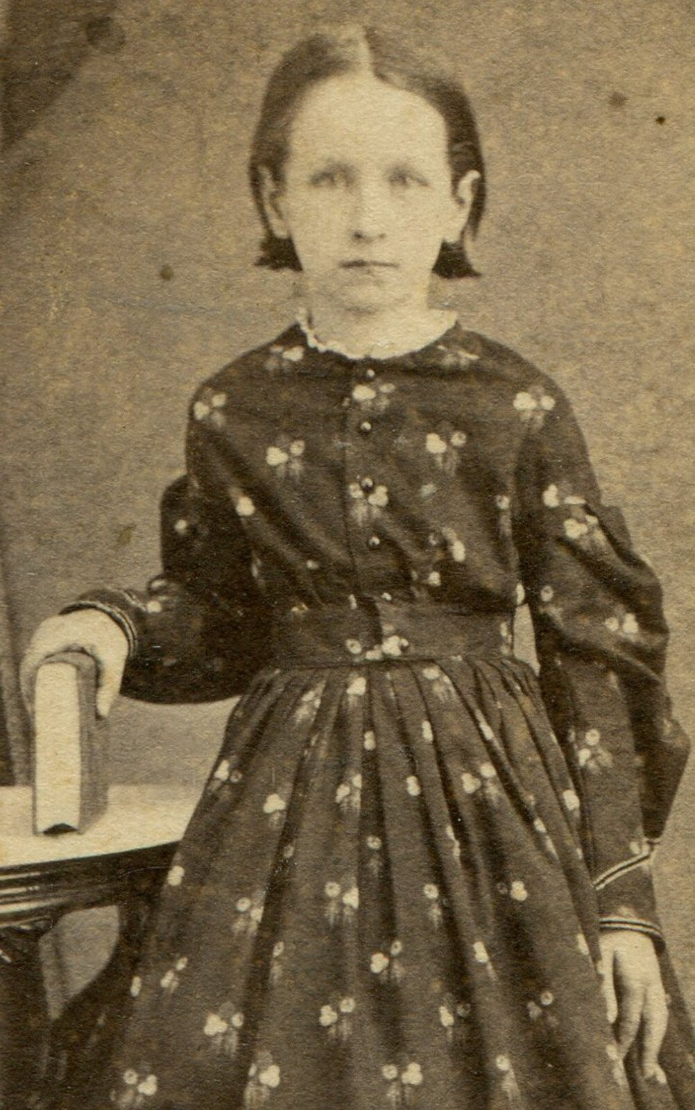 YOUNG GIRL, STANDING POSE W/BOOK, BUSY PATTERNED DRESS. CDV. SELINSGROVE, PA.