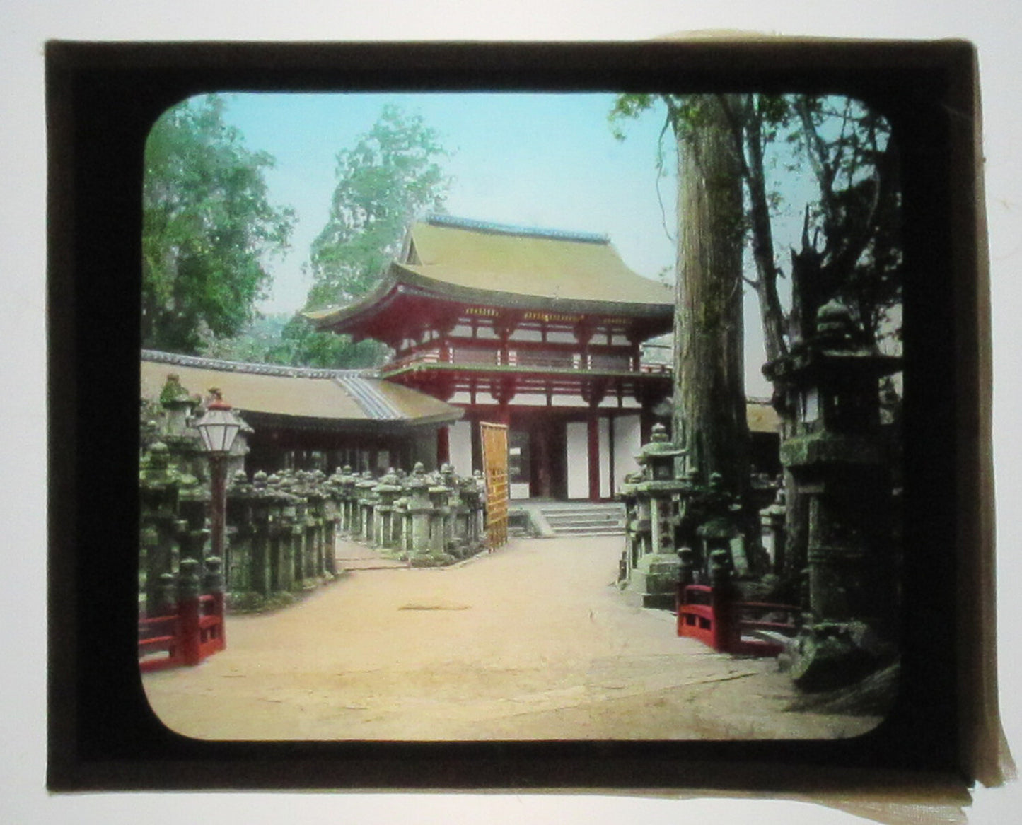 TRADITIONAL JAPANESE BUILDING. HAND COLORED PHOTO ON GLASS.