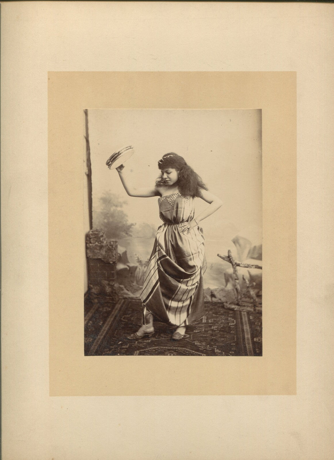 Vintage albumen photograph of a Black actress playing tambourine, 6.5x4.5 image on 12x9.5 card