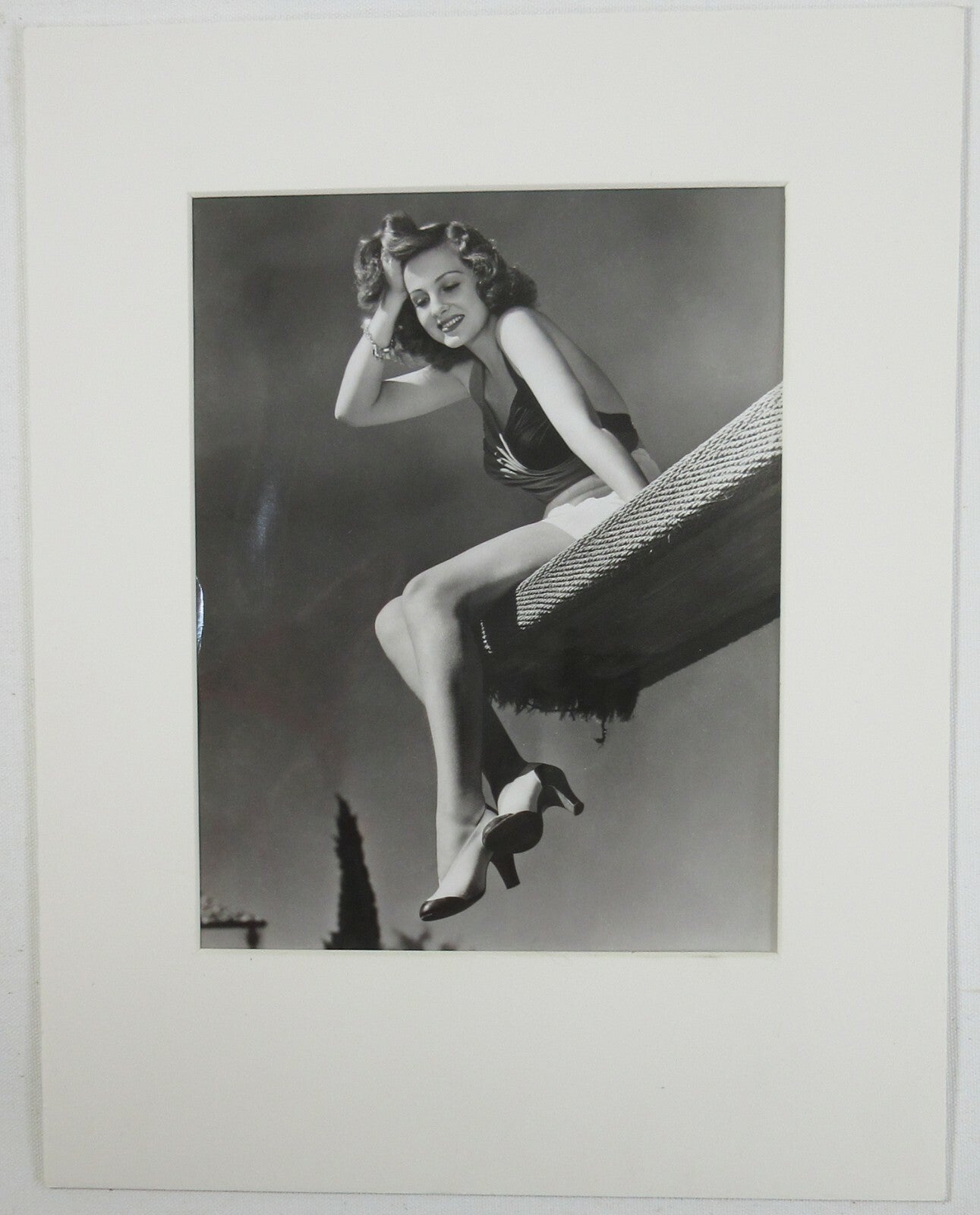 ACTRESS CONSTANCE MOORE SITTING ON DIVING BOARD. 8X10 B&W IN 11X14 ARCHIVAL MAT.