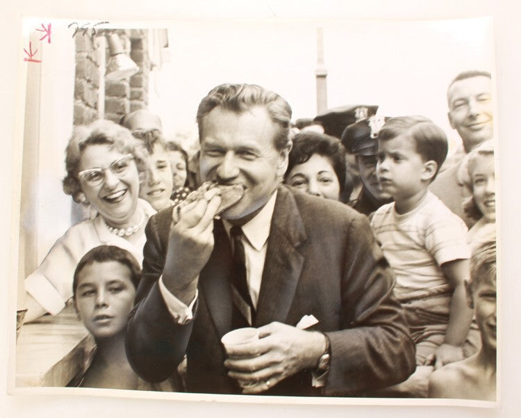 11X14 1962 PHOTOGRAPH OF POLITIAN NELSON ROCKEFELLER EATING HOT DOG W/ CROWD