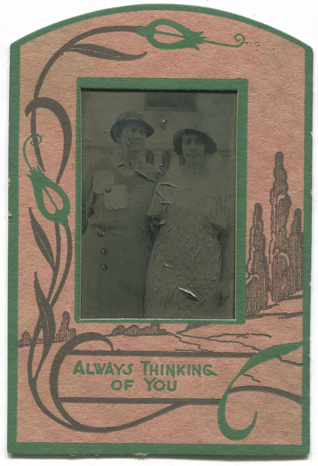TWO WOMEN IN HATS AND PRETTY DRESSES. TINTYPE IN PERIOD PAPER MAT.