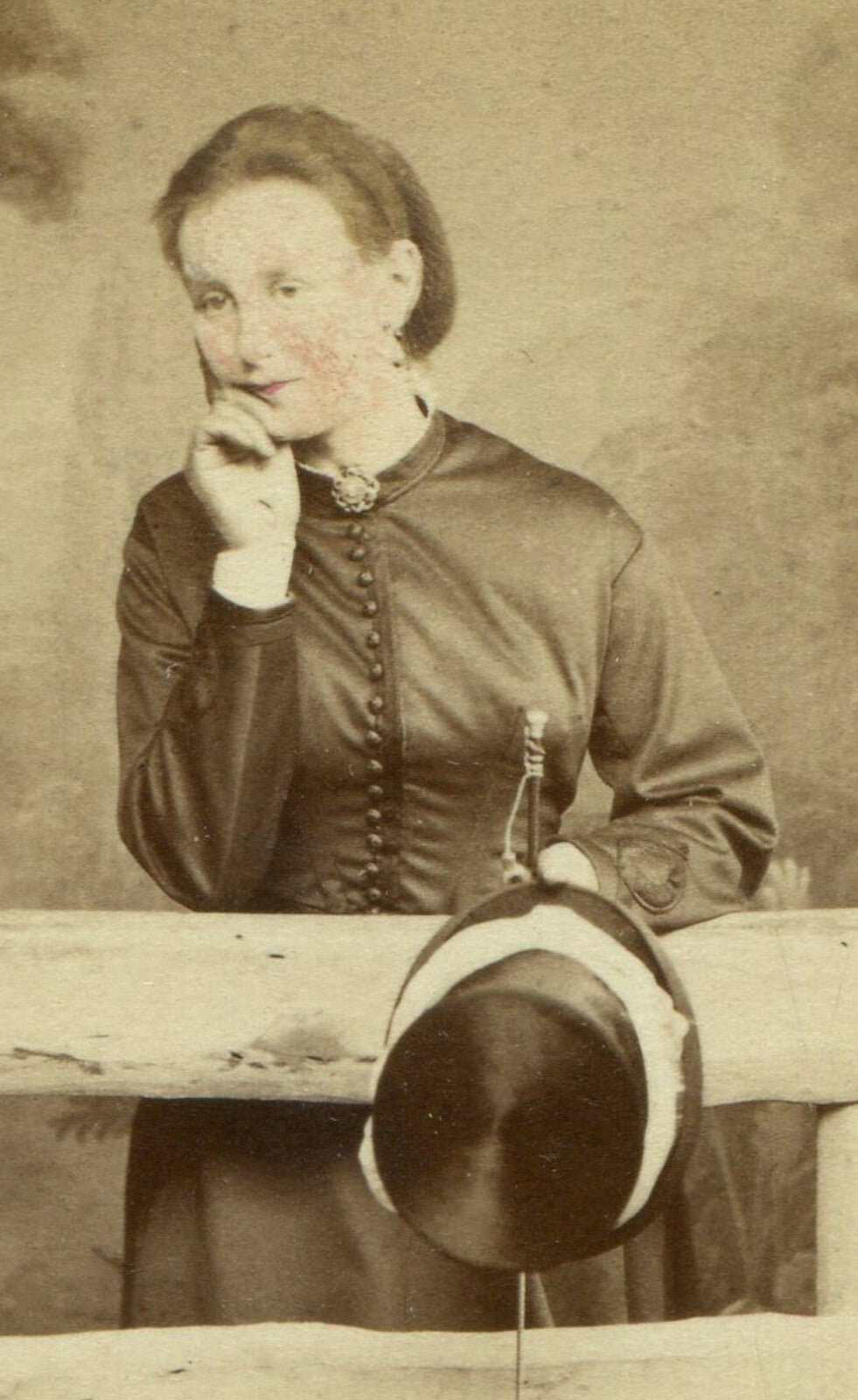 WOMAN IN RELAXED POSE HOLDING HAT, LEANING ON FENCE GATE. CDV. BRIGHTON, ENGLAND