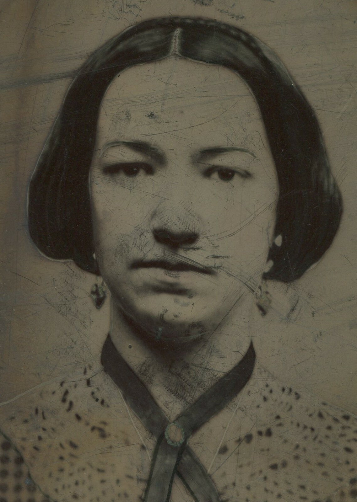 WOMAN IN CHECKERED DRESS, RIBBON NECKLACE, AND EARRINGS. TINTYPE 8.5X7 IN.