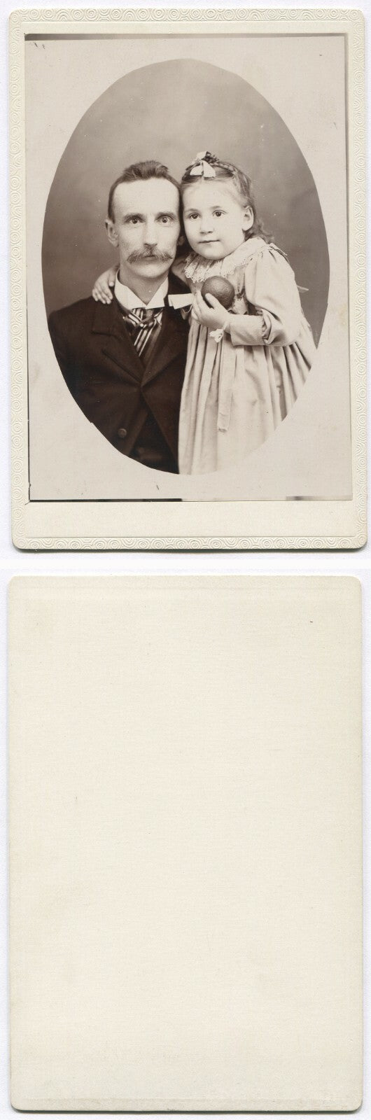 FATHER WITH YOUNG DAUGHTER, HOLDING A TOY. CABINET CARD.