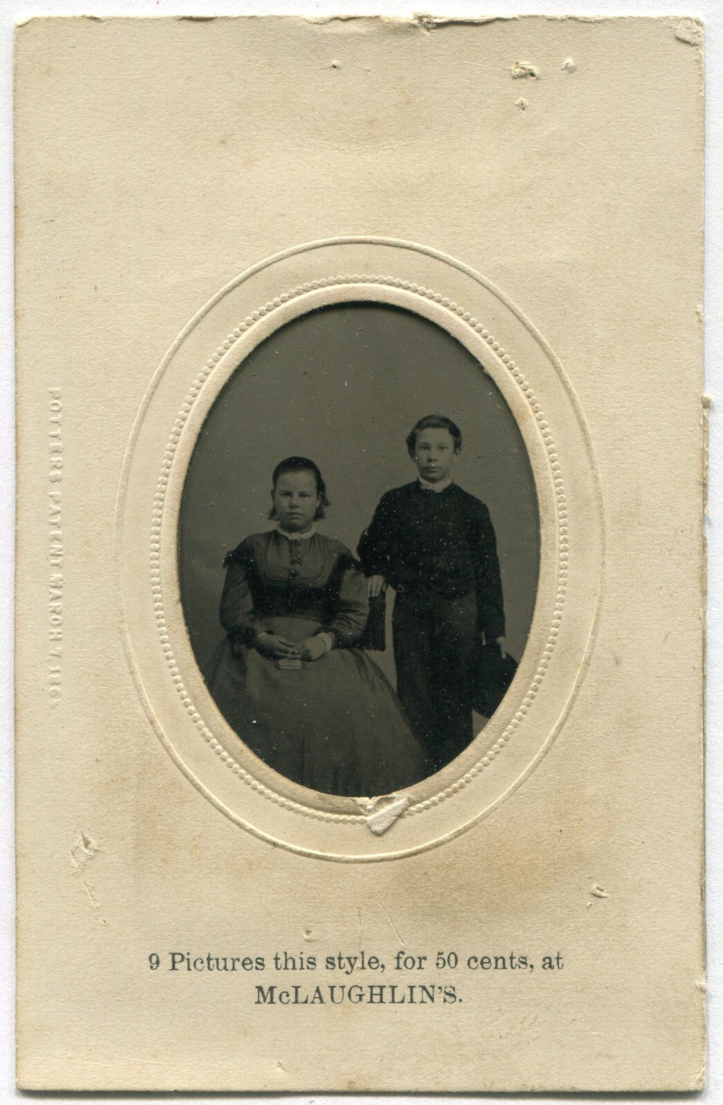 YOUNG SIBLINGS. GIRL W/PURSE, BOY HOLDING HAT. TINTYPE IN PERIOD PAPER MAT.