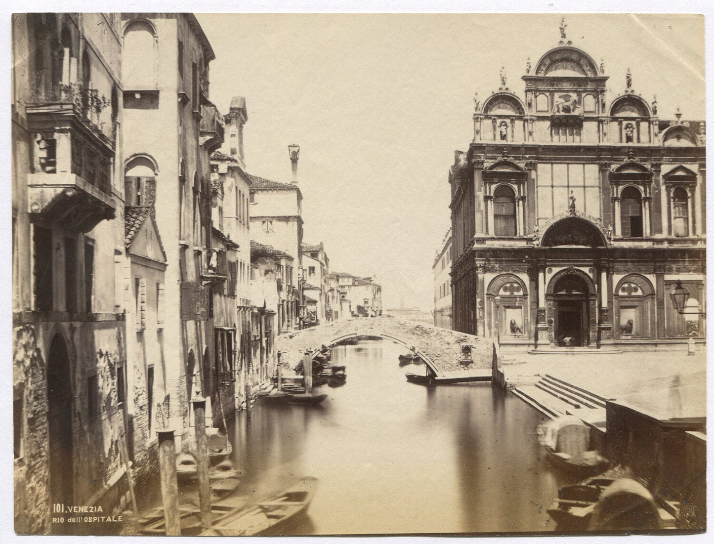 VENICE CANAL, GONDOLAS, BRIDGE, AND BUILDINGS. UNMOUNTED ALBUMEN.