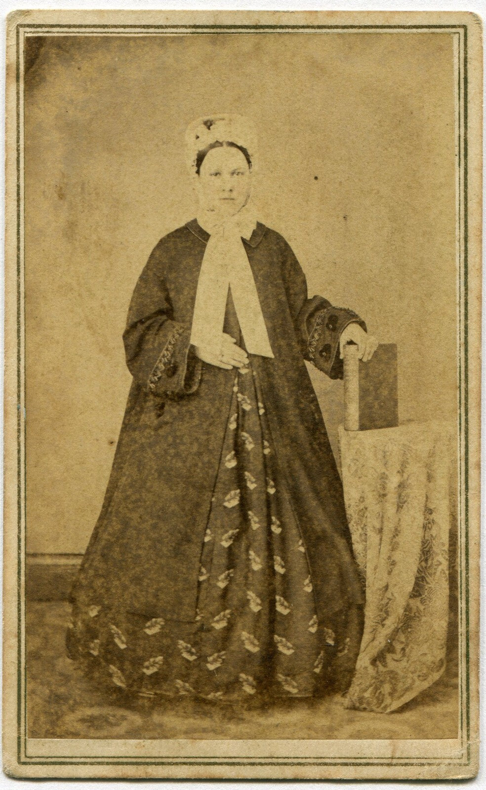 WOMAN, STANDING POSE, MANY LAYERS OF CLOTHES, HOLDING BOOK. CDV.