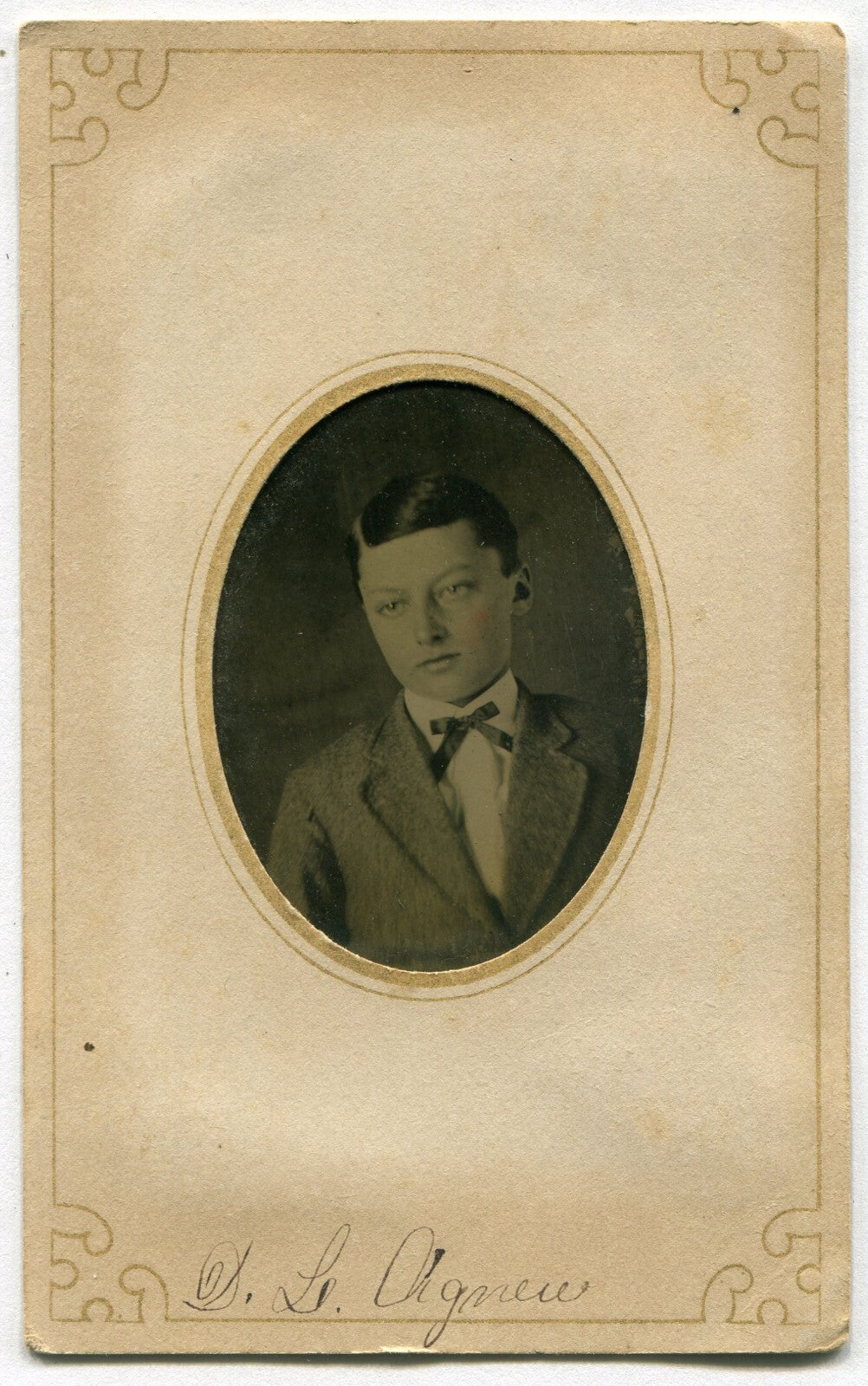 PRETTY BOY. SHARP PORTRAIT, TINTED TINTYPE IN PERIOD PAPER MAT.