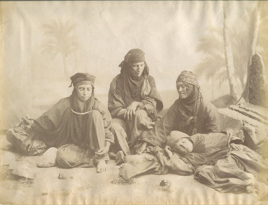 BEDOUINE FAMILY IN RELAXED POSE. ALBUMEN PHOTO IN 11X14 ARCHIVAL MAT.