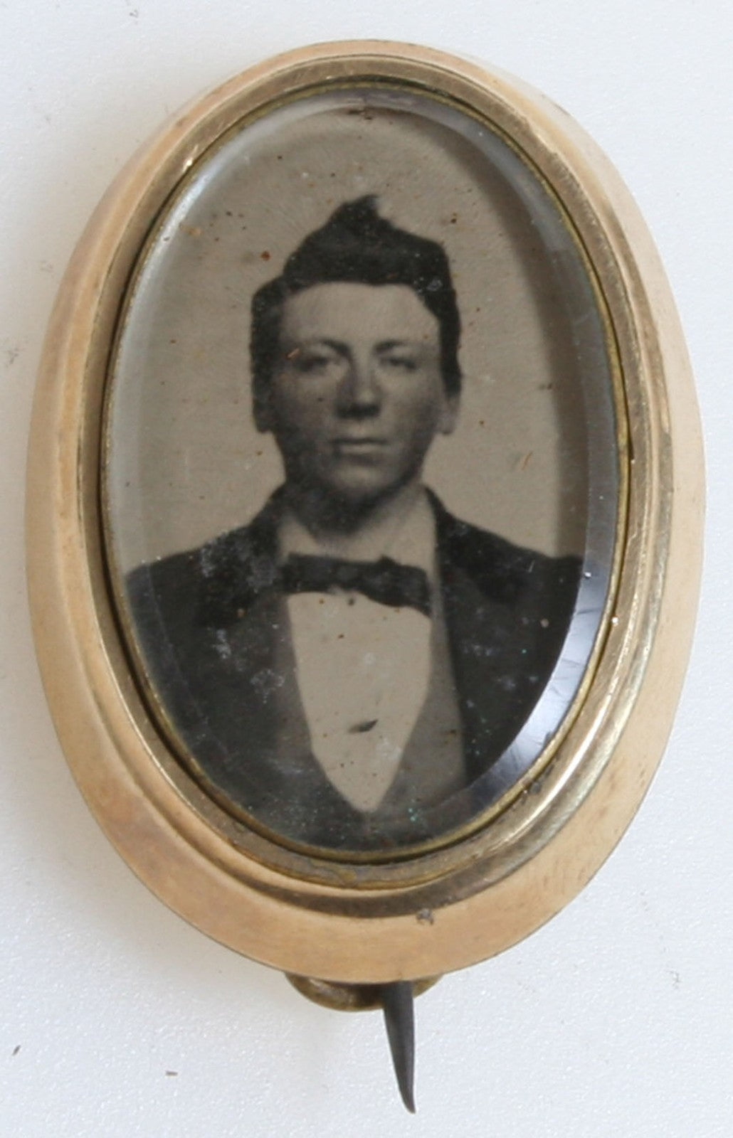 Pin, Jewelry, Tintype. Man With Short Pompadour. Gold Pin. 1860s.