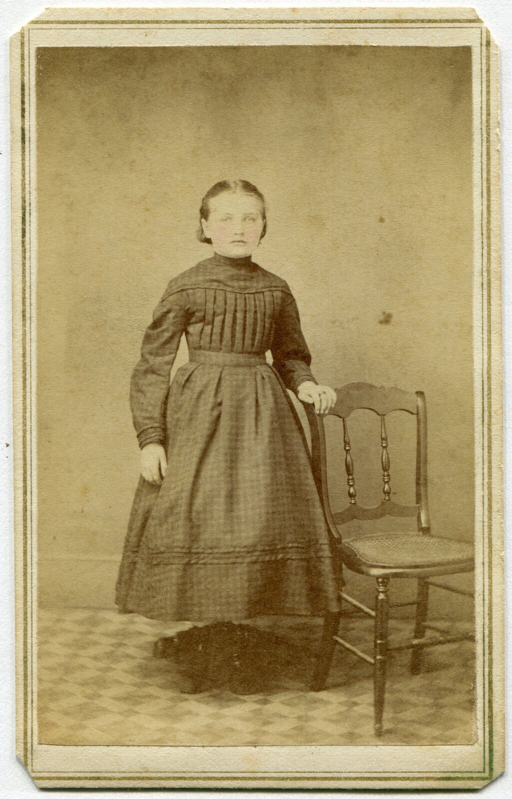 ROUND FACED YOUNG GIRL, STANDING POSE. TINTED CDV. PILLOW, PA.