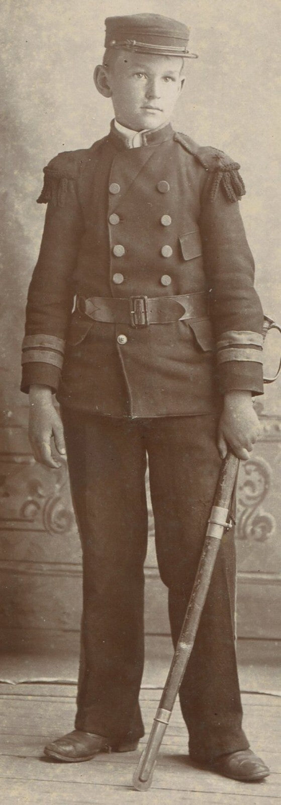 BOY WITH SABER IN MILITARY ACADEMY UNIFORM. CABINET CARD.