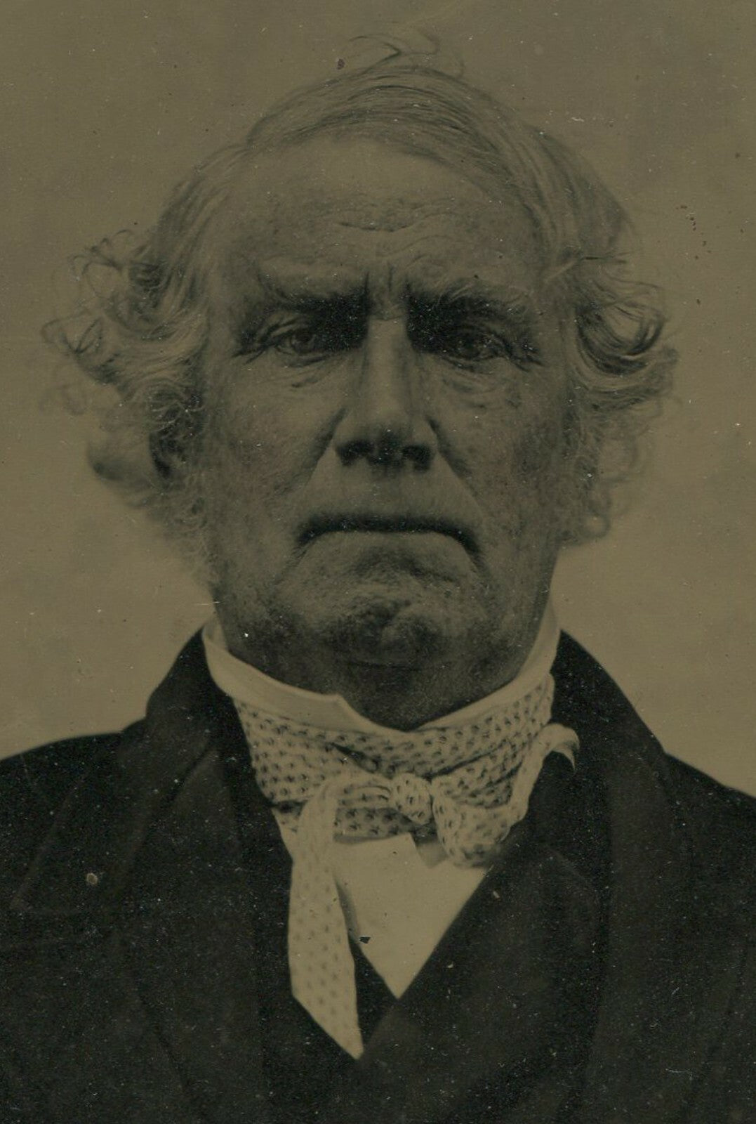 OLD MAN, HIGH COLLAR, HANDS CROSSED ON LAP. TINTYPE, 6.5 X 8.5 IN.