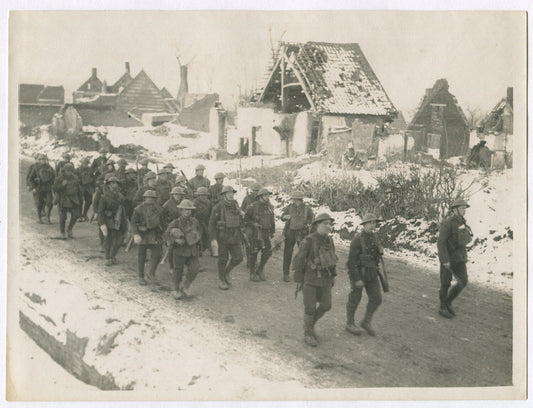 BRITISH EAST LANCASHIRES MARCH THROUGH RUINED VILLAGE. WWI. (8X10 REPRINT)