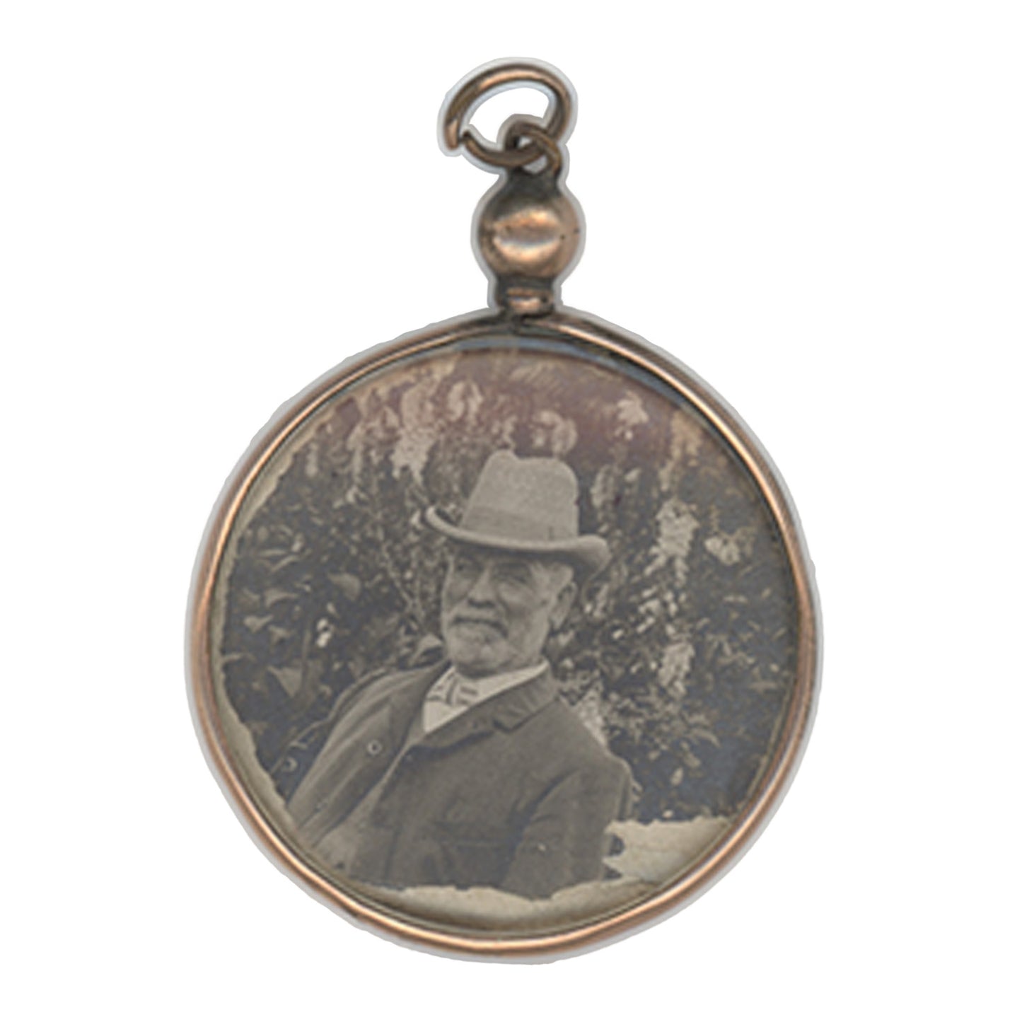 Round pendant with vintage portrait of a man wearing a hat on a white background