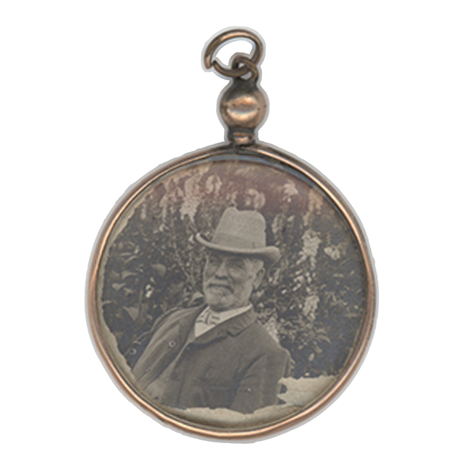 Round pendant with vintage portrait of a man wearing a hat on a white background