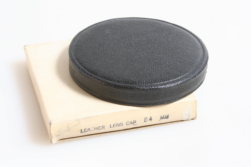 84MM BLACK SLIP ON LEATHER LENS CAP, NEW IN BOX