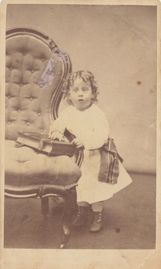 Young Child Perplexed by Large Book. CDV. Milford, Massachusetts, USA.