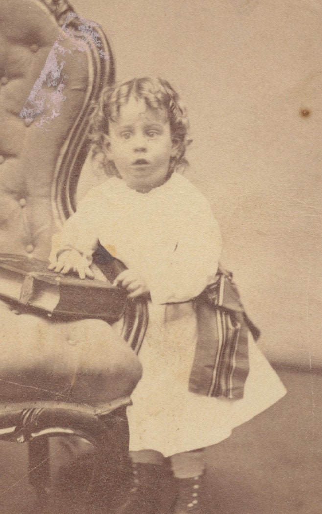 Young Child Perplexed by Large Book. CDV. Milford, Massachusetts, USA.