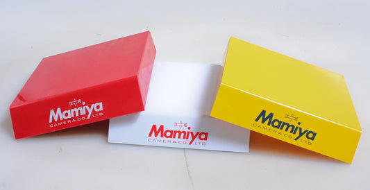 MAMIYA DEALER CAMERAS DISPLAY STANDS, LOT OF 3, WHITE, RED AND YELLOW
