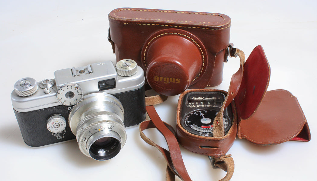 AGRUS C-FOUR 35MM FILM RANGEFINDER CAMERA, LEATHER CASE, STRAP, AND LIGHT METER