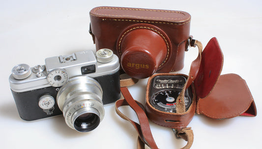 AGRUS C-FOUR 35MM FILM RANGEFINDER CAMERA, LEATHER CASE, STRAP, AND LIGHT METER