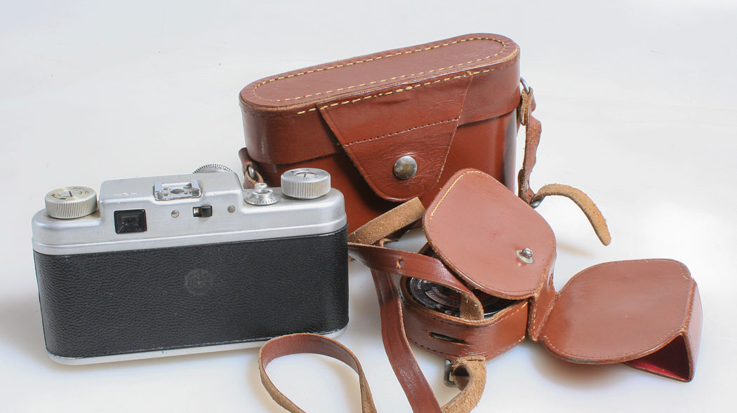 AGRUS C-FOUR 35MM FILM RANGEFINDER CAMERA, LEATHER CASE, STRAP, AND LIGHT METER