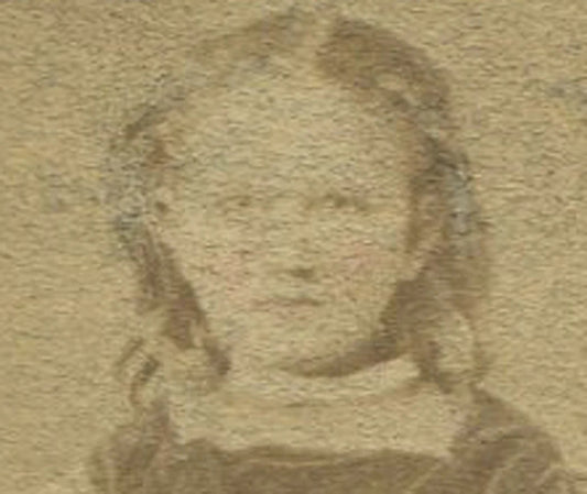 YOUNG GIRL WITH HIGH TOP SHOES, SEATED AT TABLE. TINTED CDV.